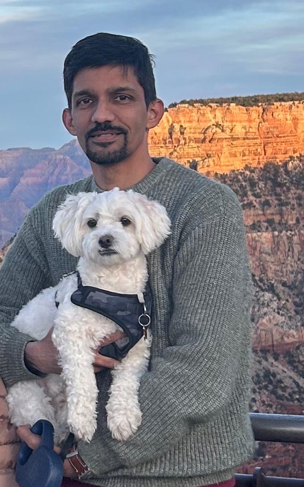 Praveen Gangaraju with his dog Pluto